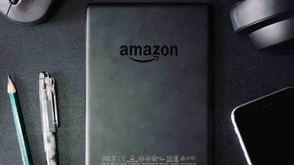 A tablet bearing the Amazon logo on the back