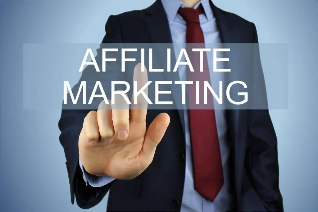 A man in a suit pointing at a graphic that says 'affiliate marketing'.